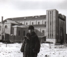 Father Charles Maillard stands in front of his beautiful new church.